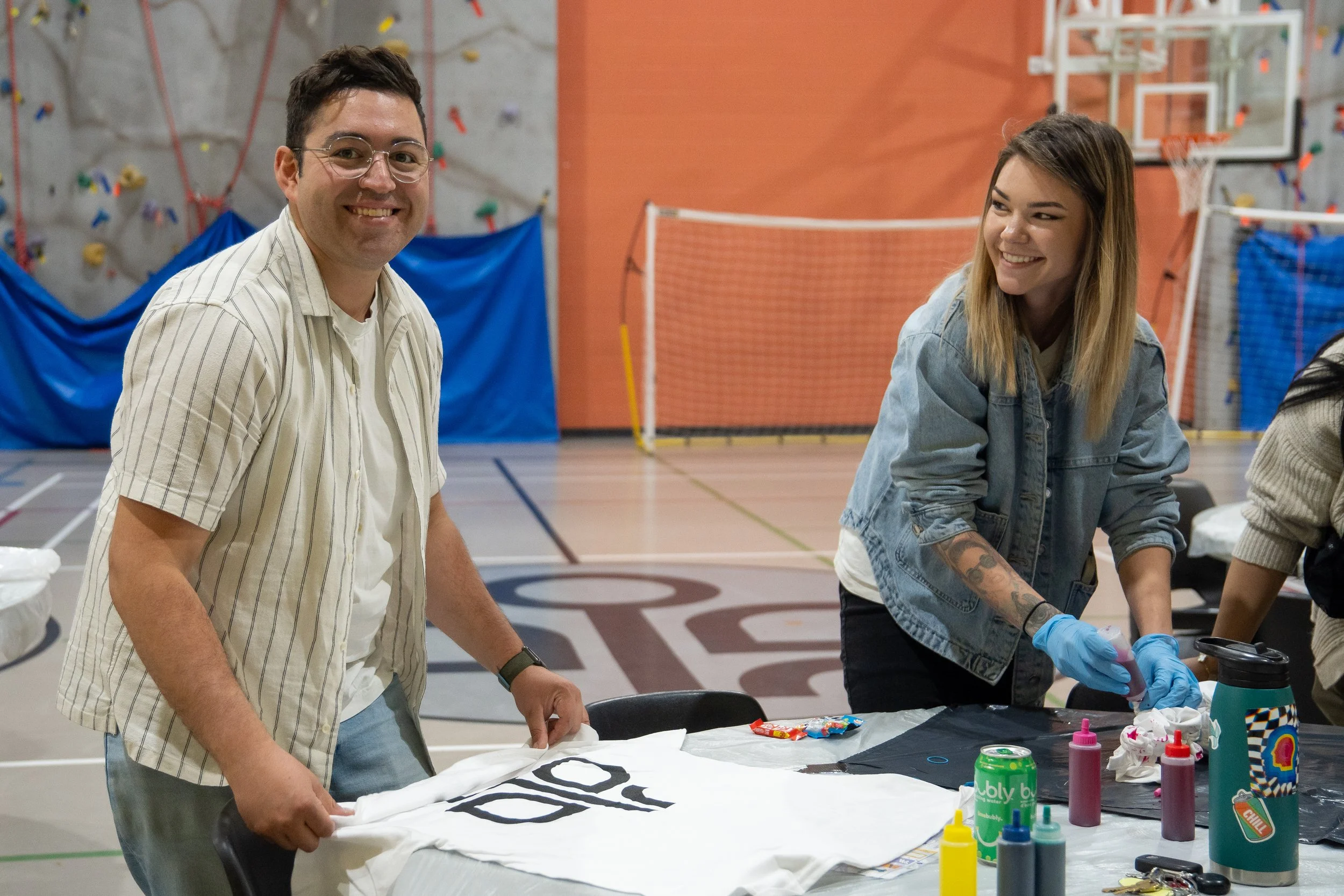 Trellis Society at Pride 2024 – Floats Into Pride with Our Housing First Approach doing some crafts