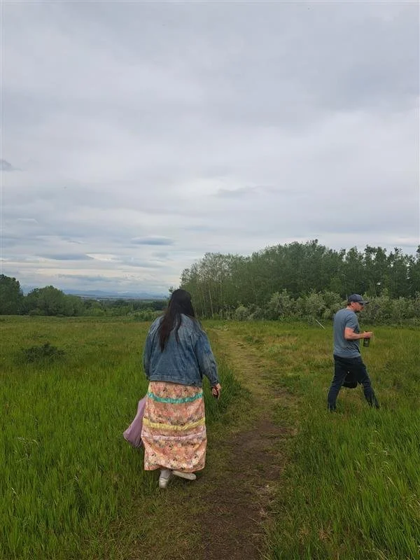 ReconciliACTION - From Awareness to Action walking along a dirt path